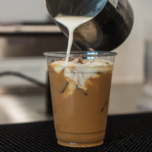 Pouring milk in Iced drink