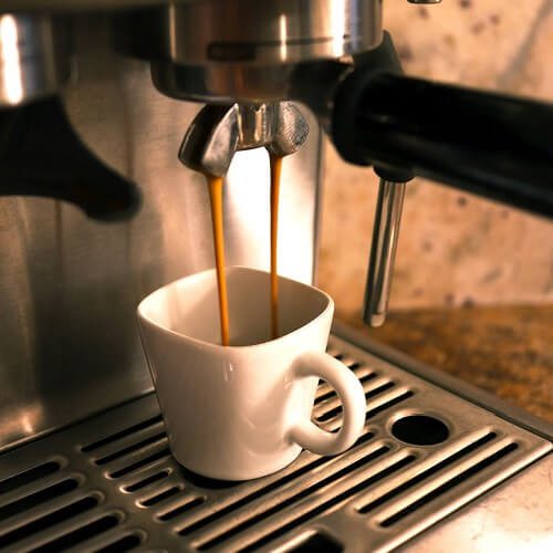 Espresso pouring into a cup at Moxie Coffee Bar.